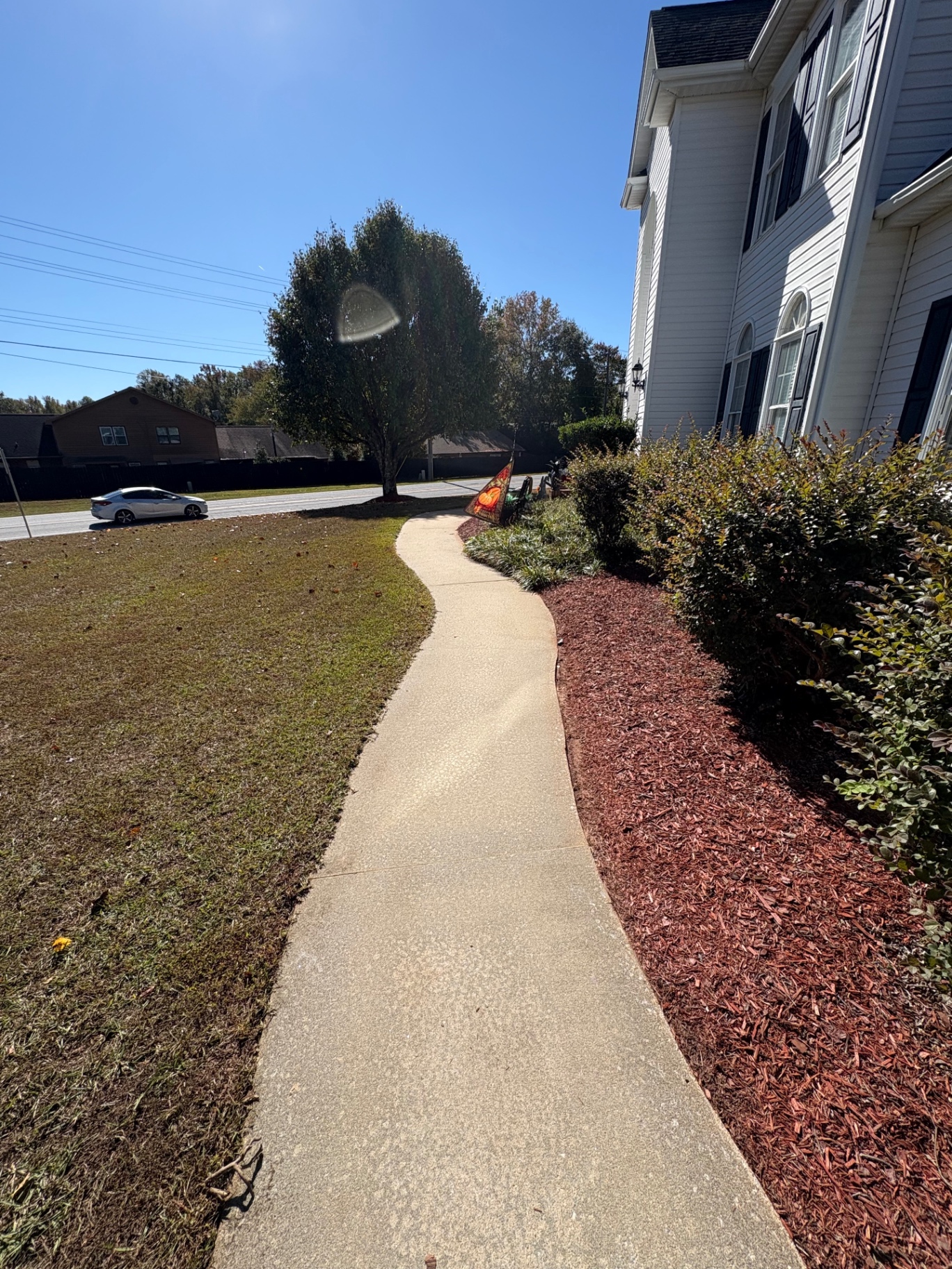 Sidewalk cleaning before and after – after